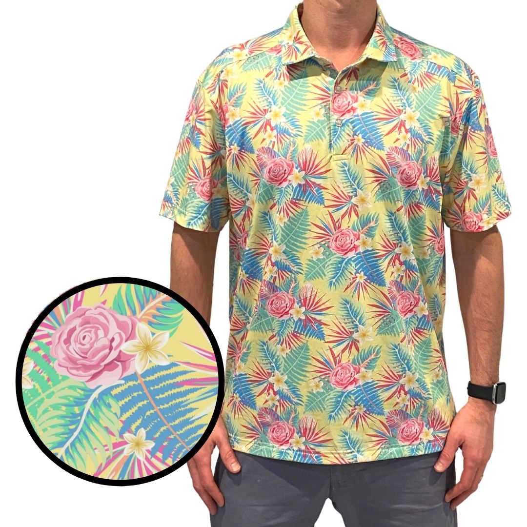 Colorful tropical patterned shirt worn by a person with a close-up of the fabric texture.