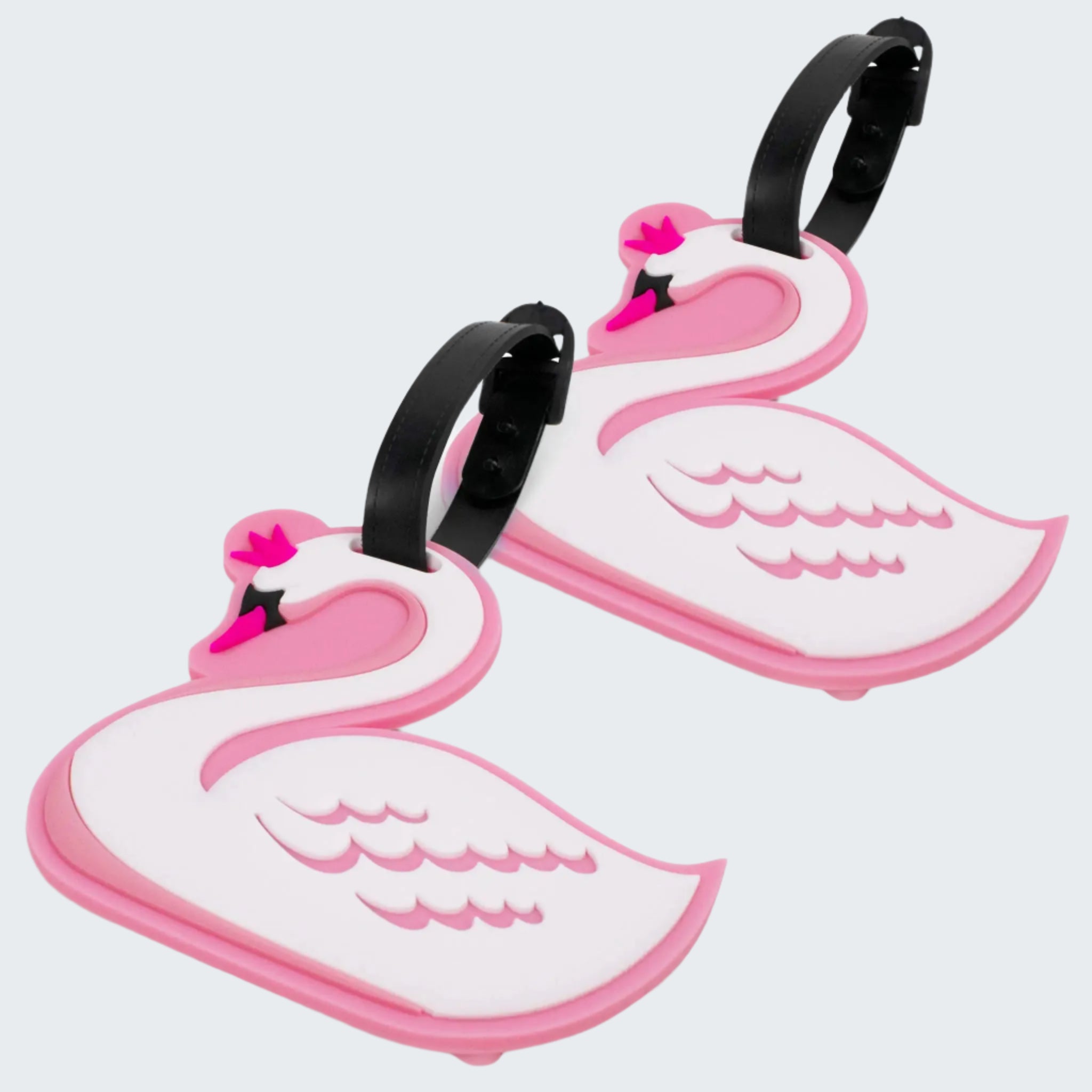 Two pink and white swan-shaped luggage tags on a white background