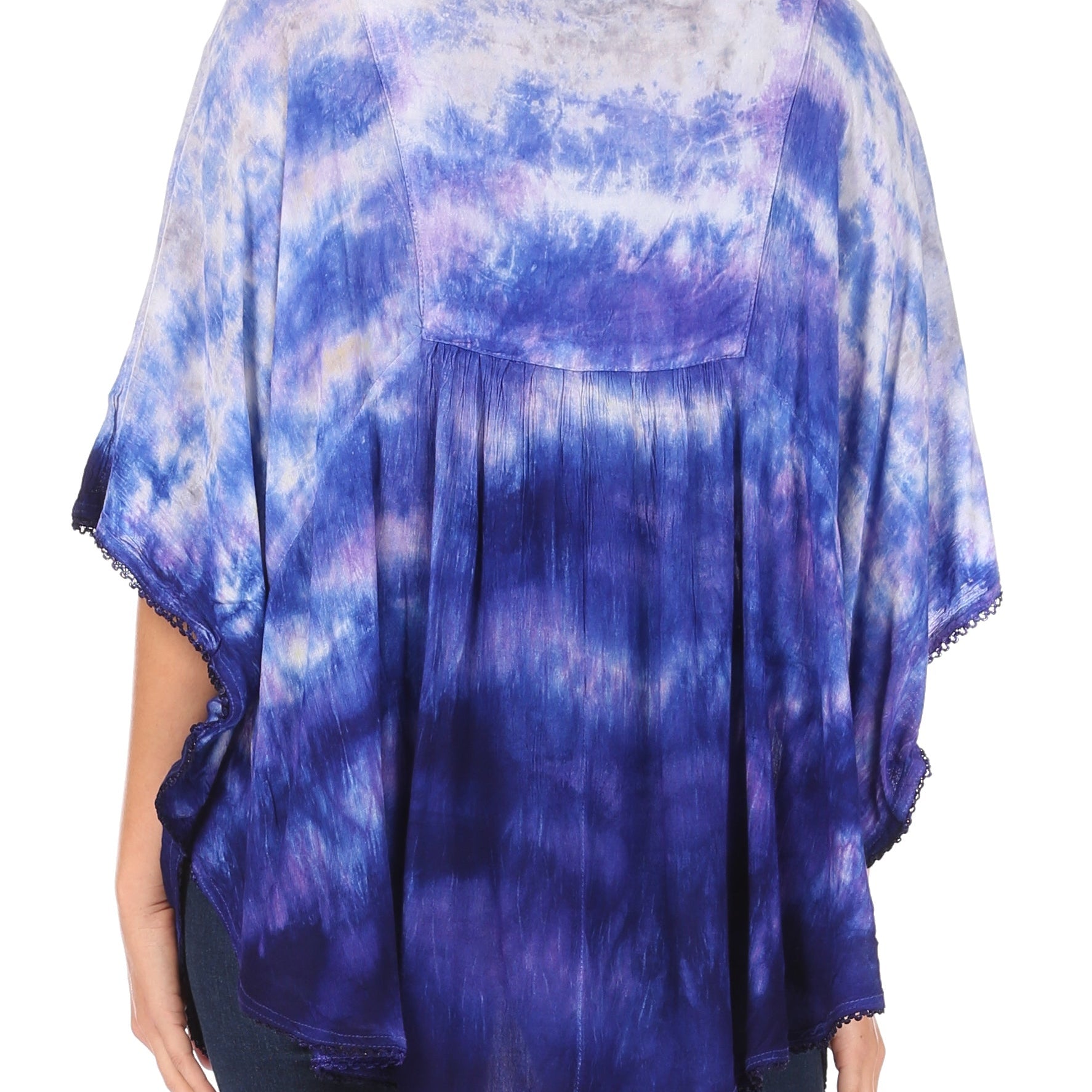 Blue and purple tie-dye top worn by a person on a white background