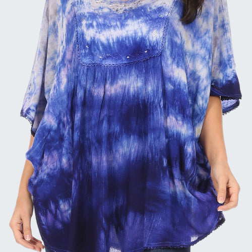 Blue tie-dye shirt worn by a person on a white background
