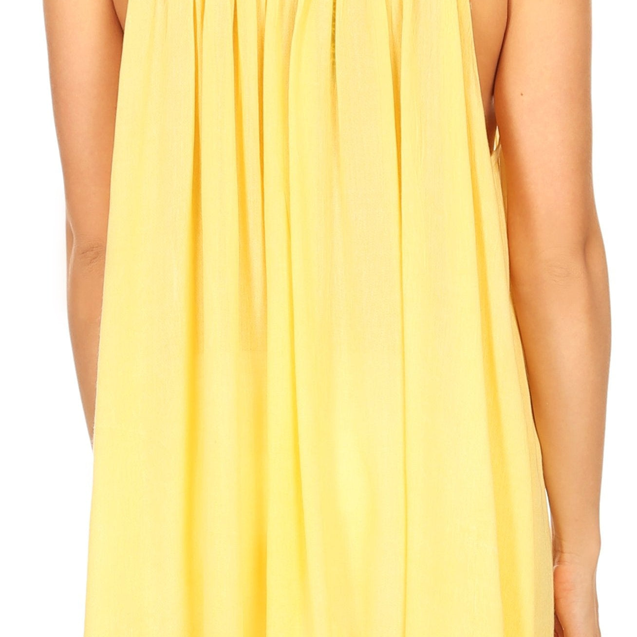 Yellow sleeveless top worn by a person on a white background