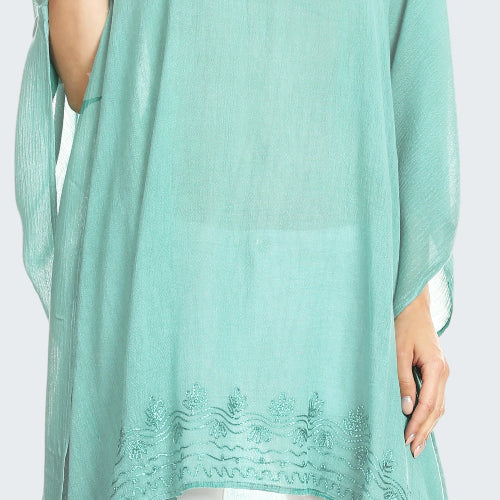 Mint green lace top worn by a model on a white background