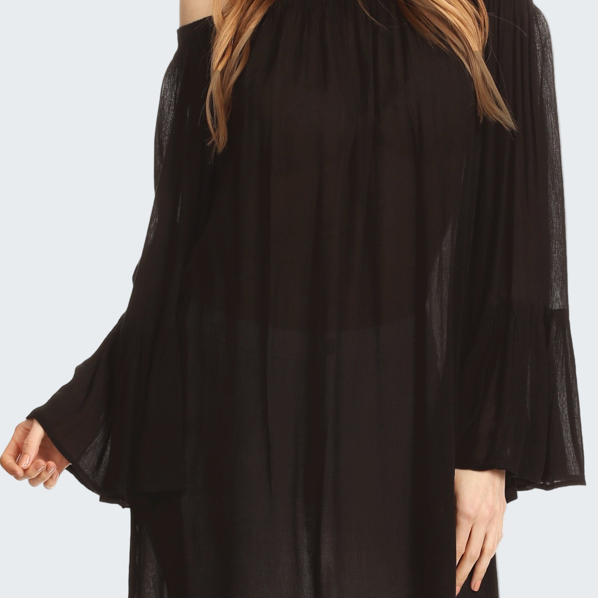 Black off-shoulder blouse worn by a model on a white background