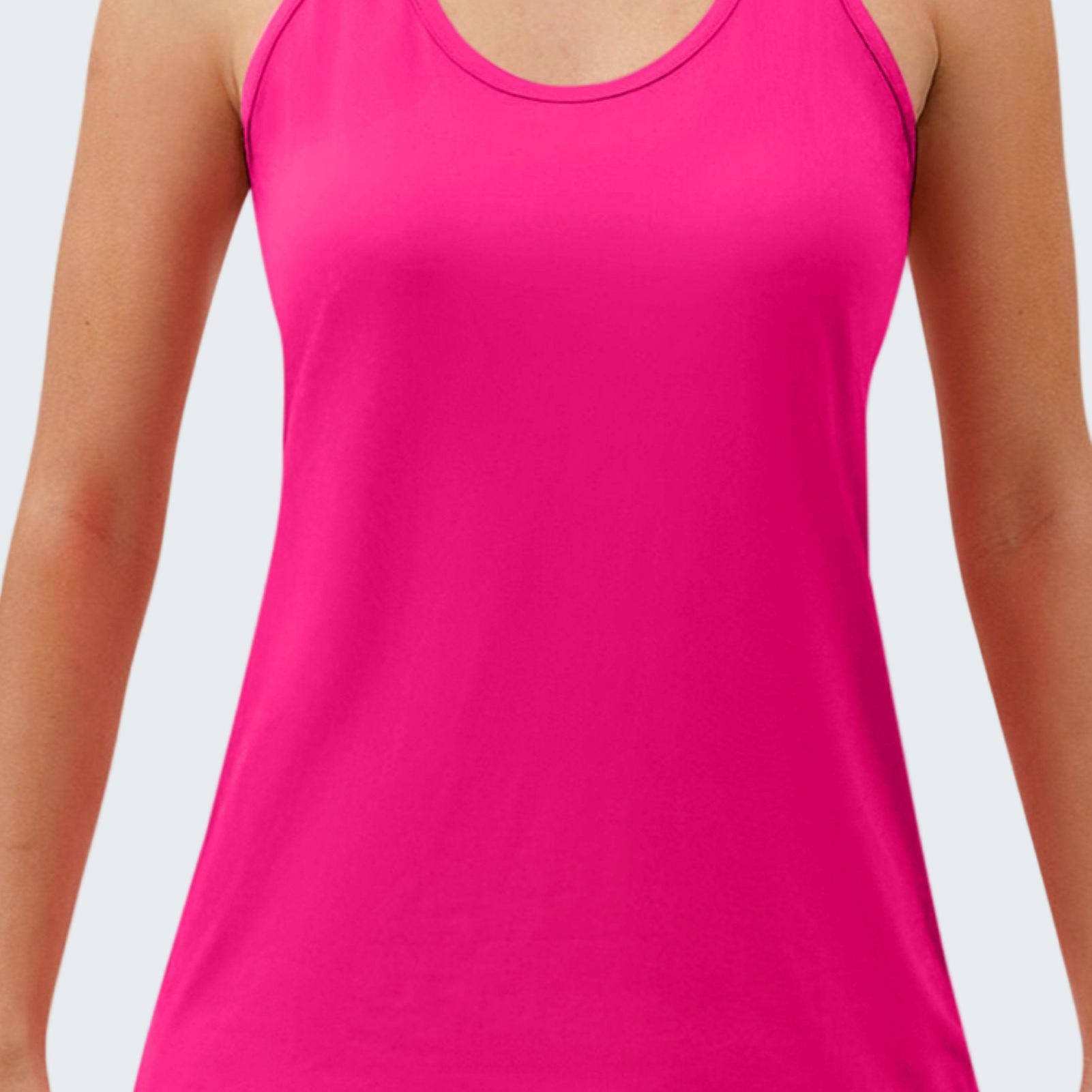 Pink tank top worn by a person on a white background