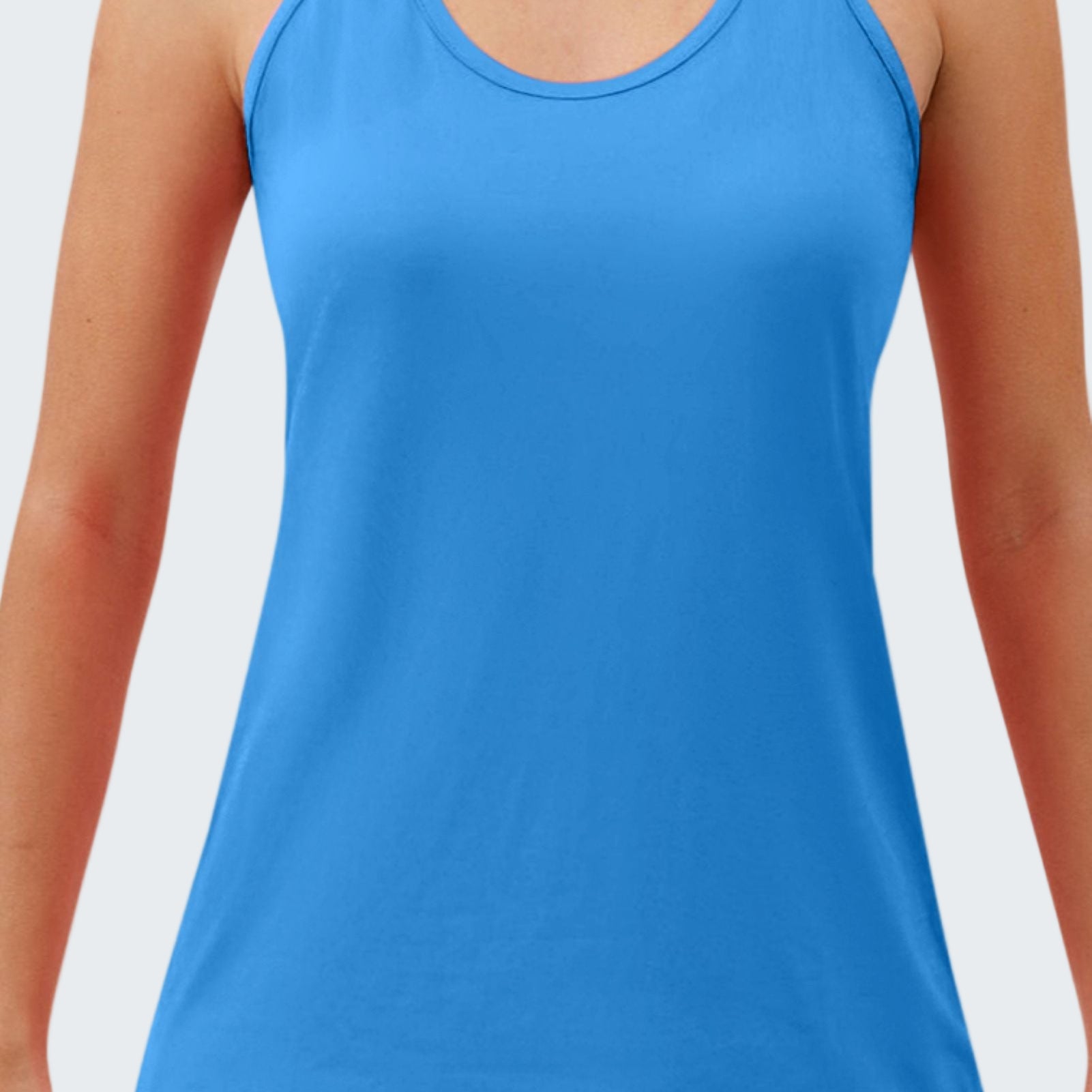 Blue tank top worn by a person on a white background