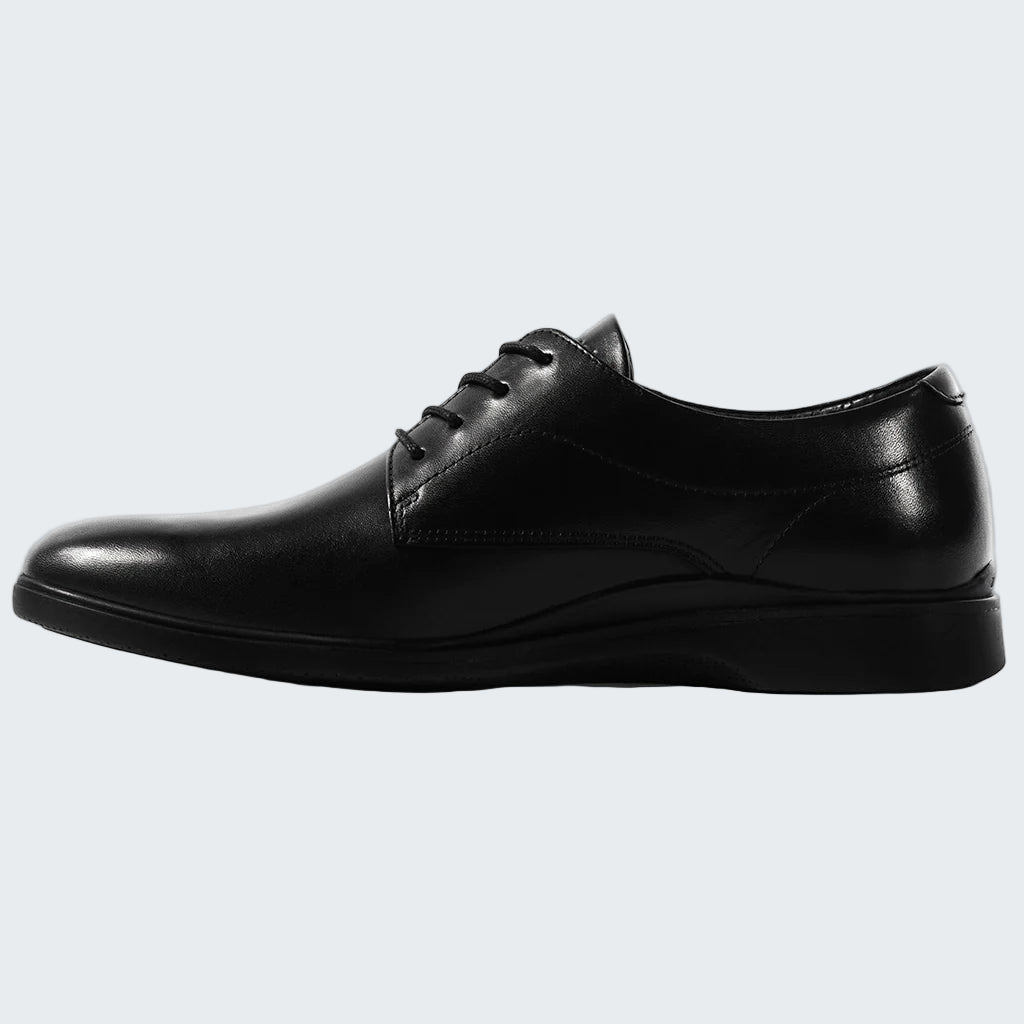 Black leather dress shoe on a white background