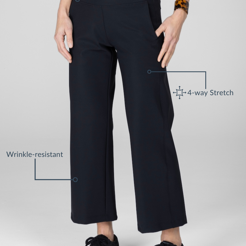 Person wearing black pants with text highlighting features on a white background