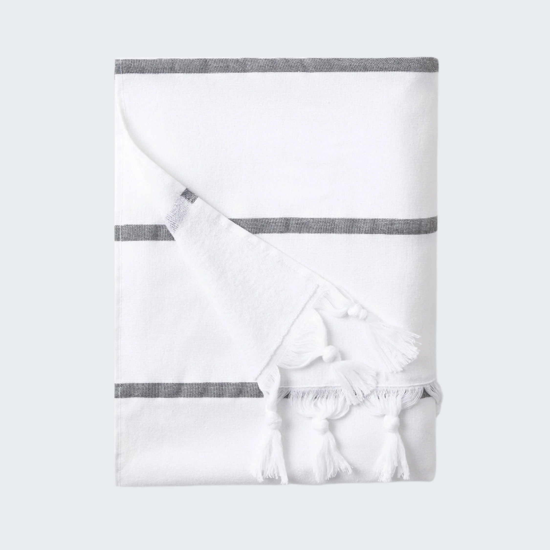 White baby blanket with gray stripes on a white background
