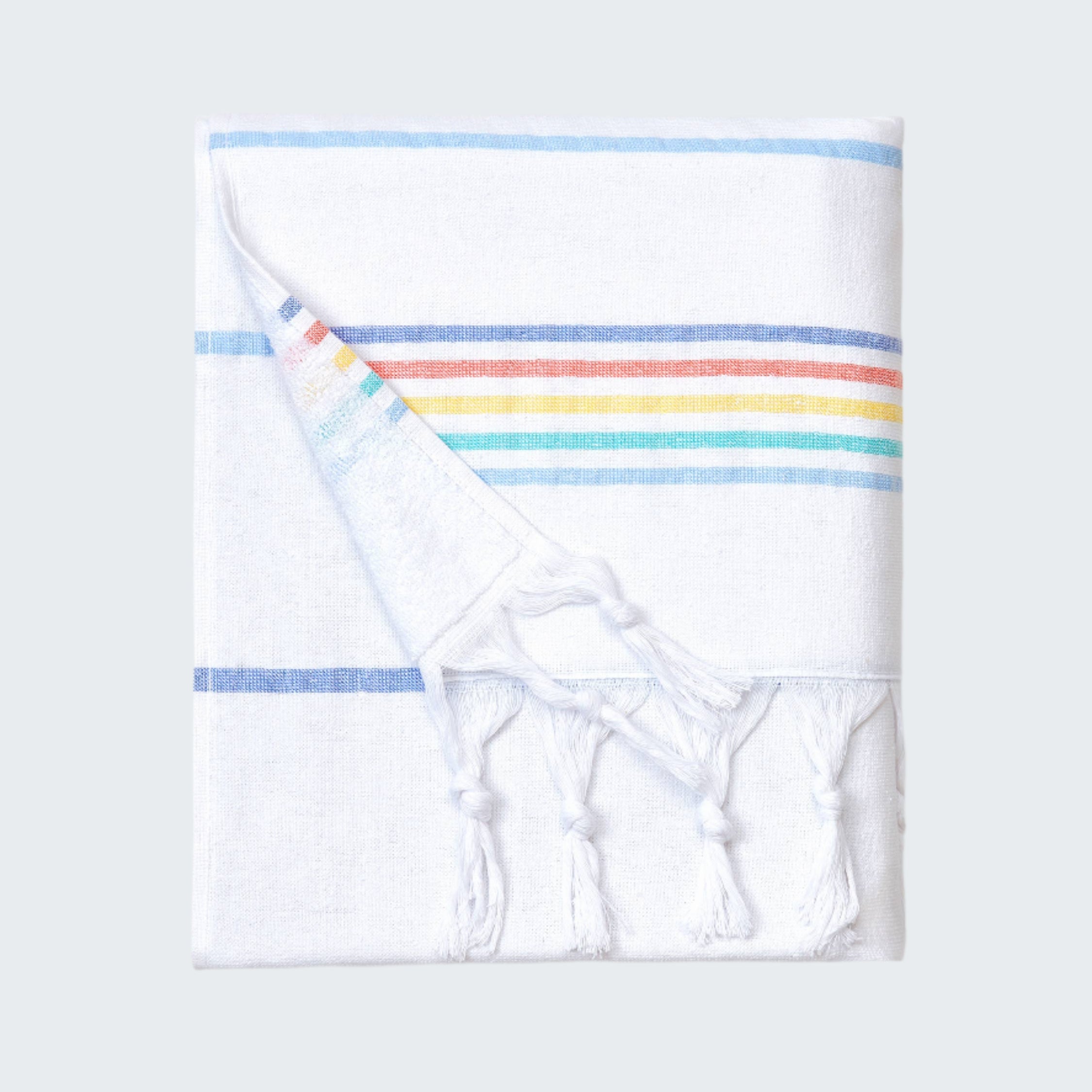 Folded towel with rainbow stripes on a white background
