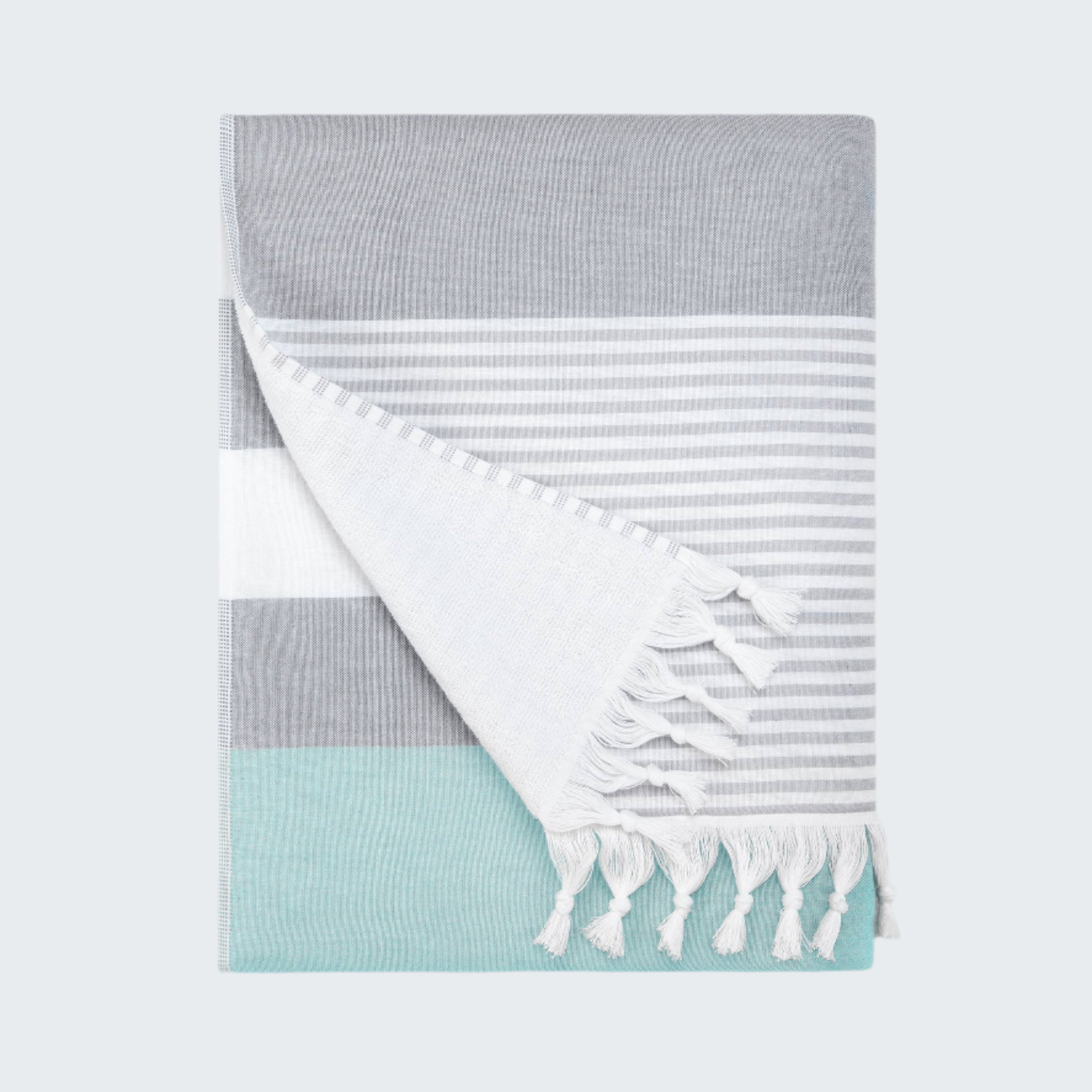 Folded towel with gray, white, and light blue stripes on a white background
