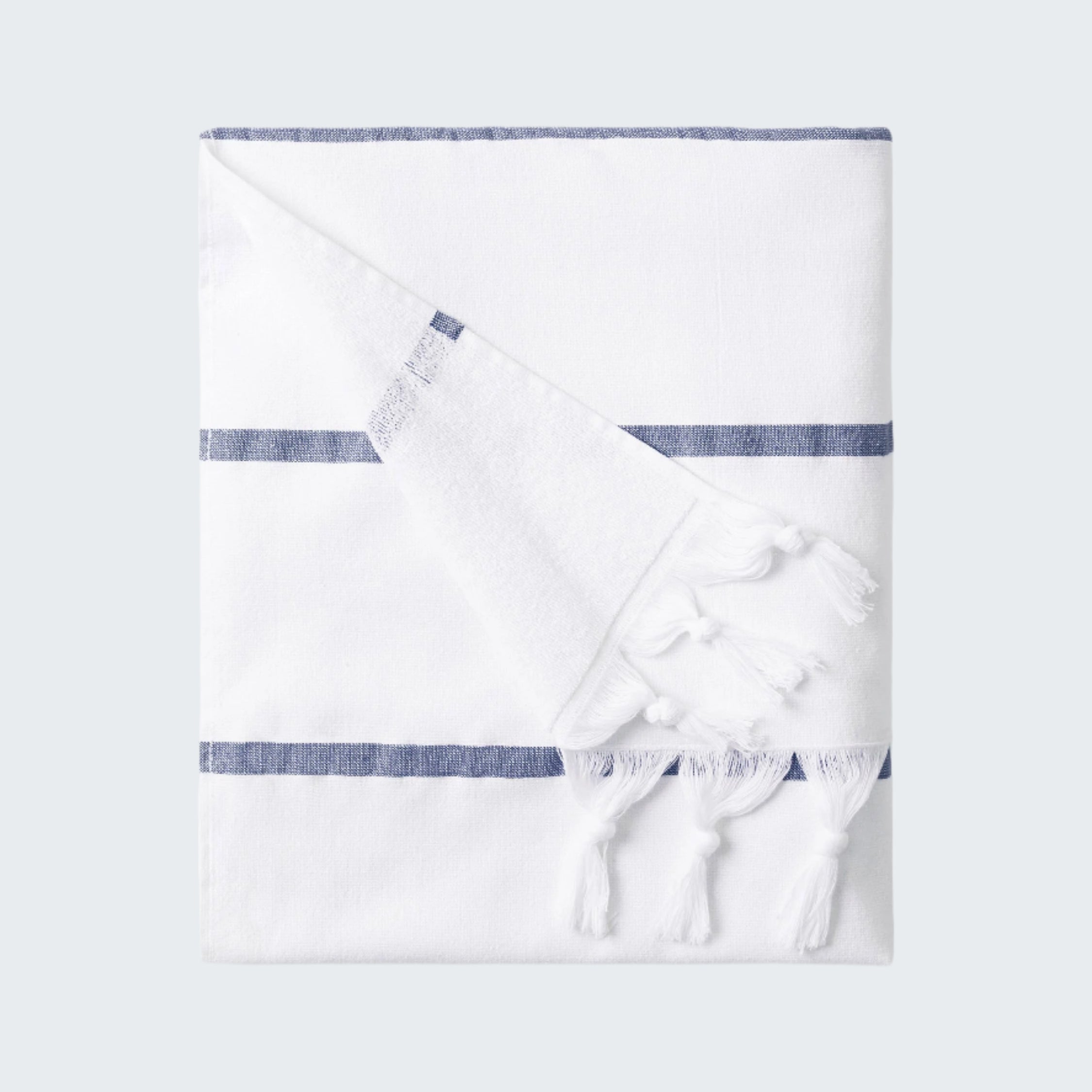 White towel with blue stripes on a white background