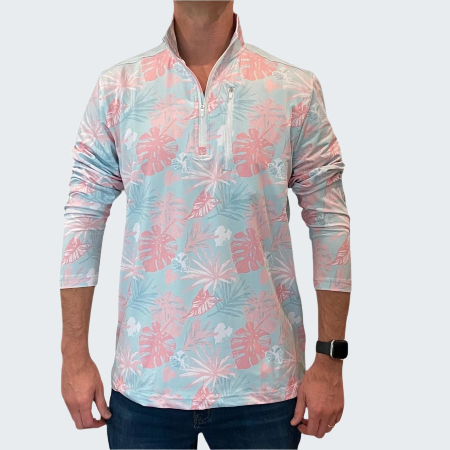 Man wearing a long-sleeve shirt with pink floral pattern on a white background
