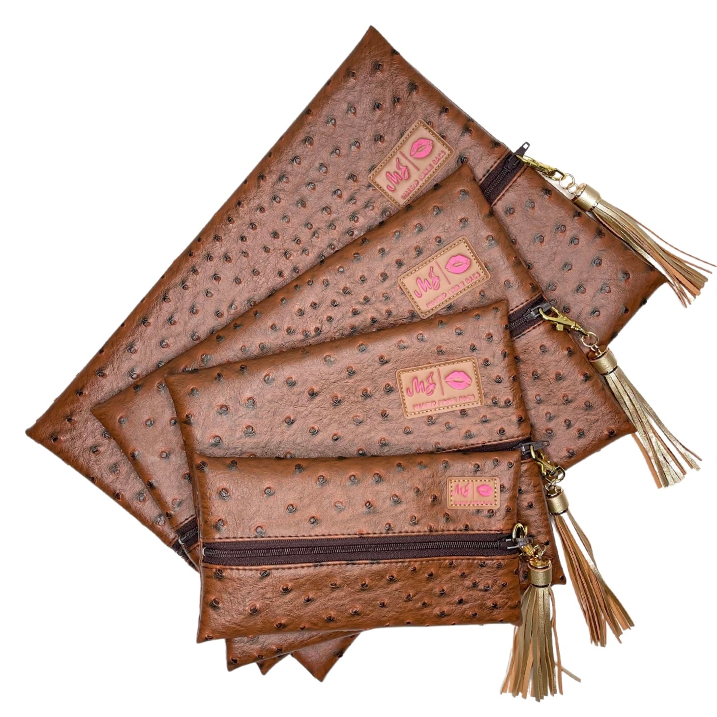 Set of brown patterned pouches with tassels on a white background