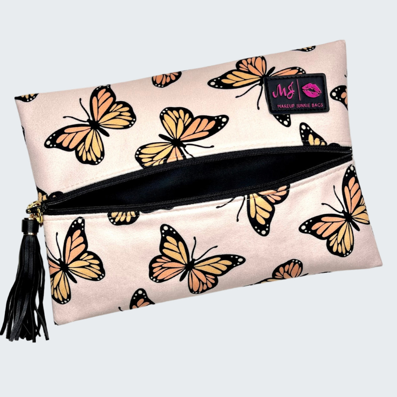 Makeup bag with butterfly pattern and visible brand logo on a white background
