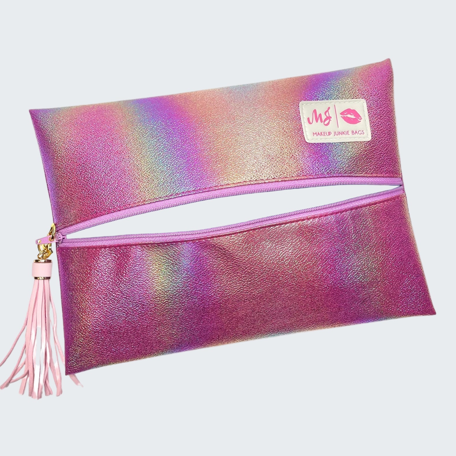 Multicolored makeup bag with a pink tassel on a white background