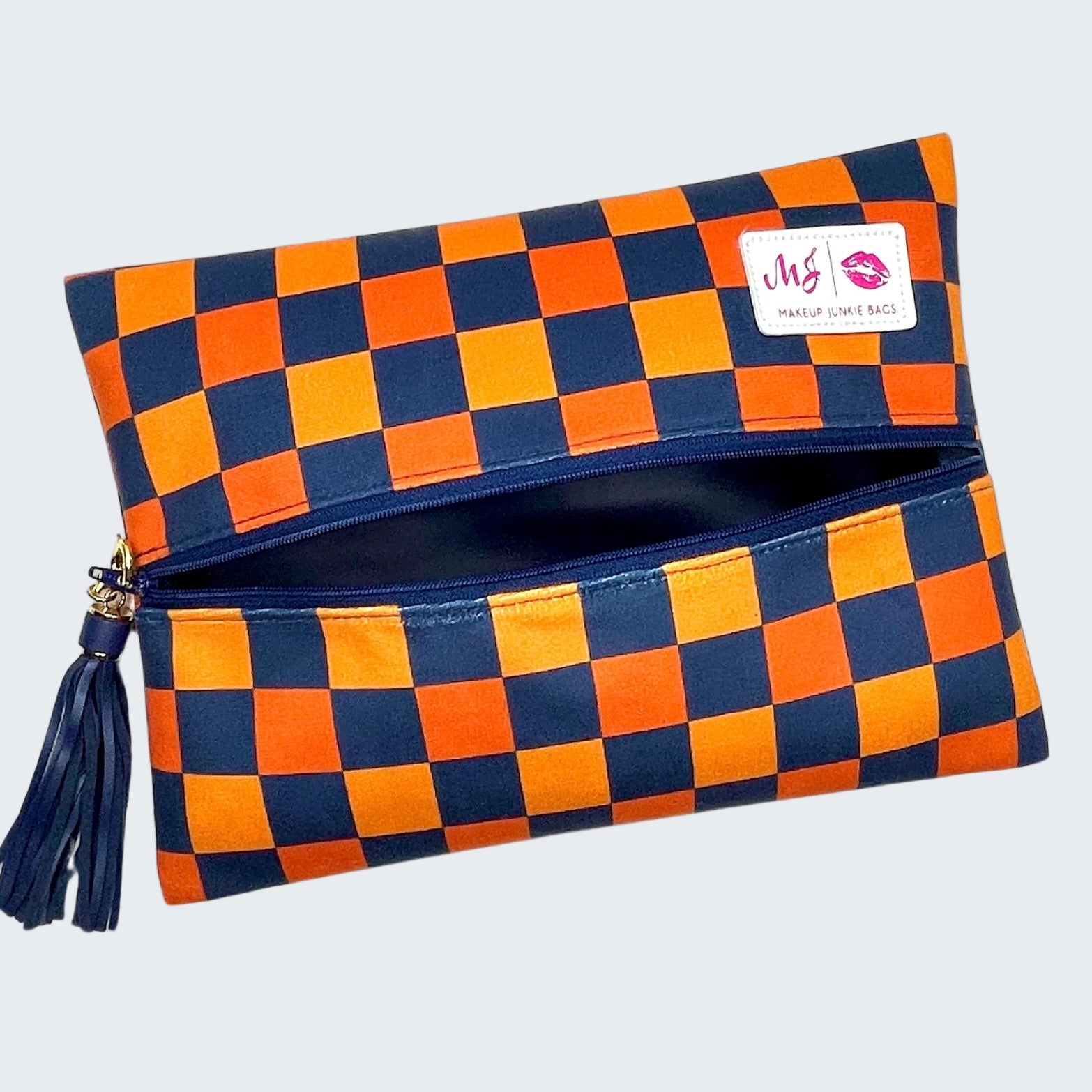 Checkered makeup bag with orange and blue pattern on a white background