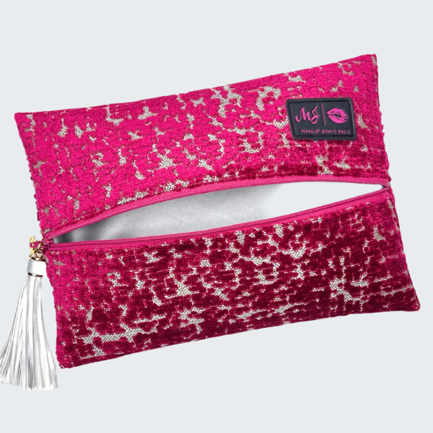 Pink makeup bag with a pattern and visible brand logo on a white background