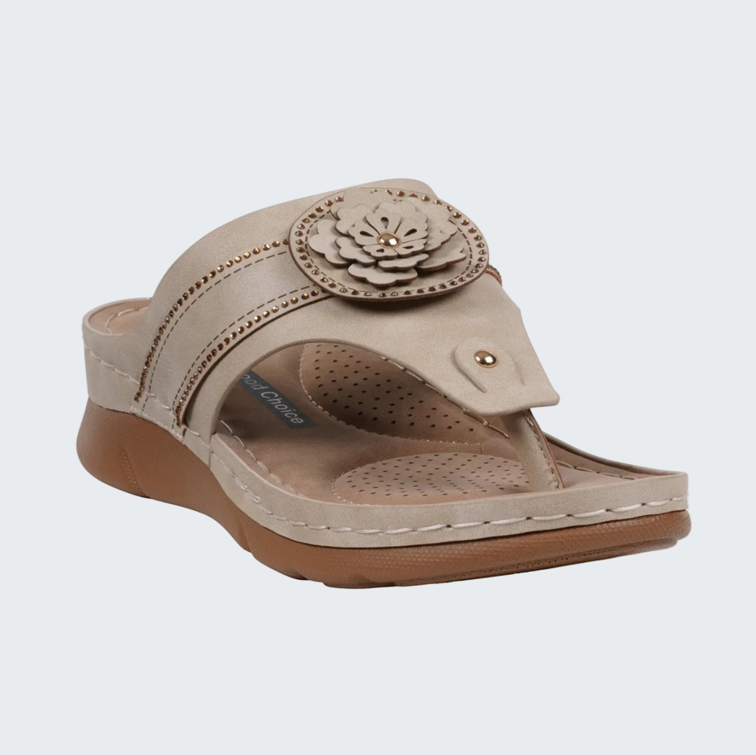 Beige sandal with a floral design on a white background