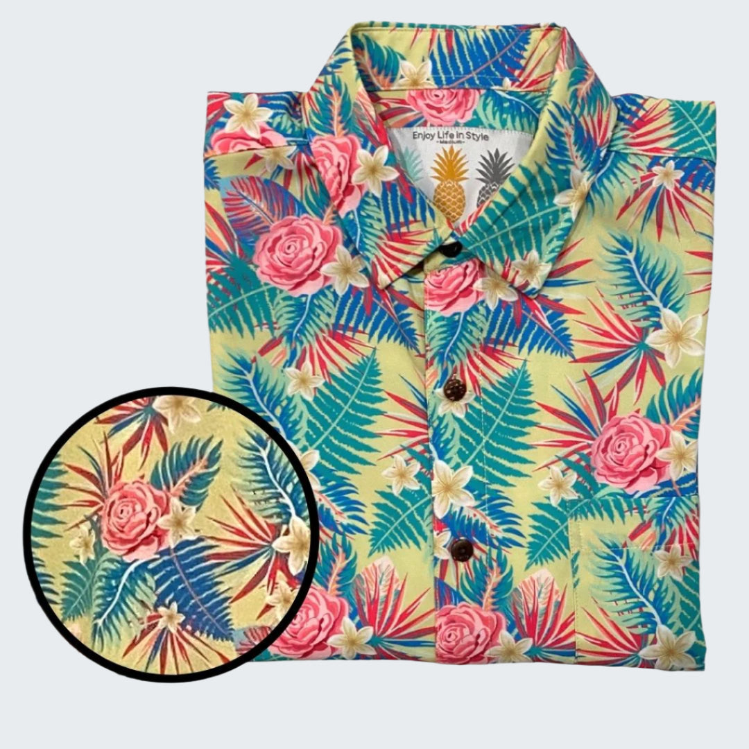 Colorful tropical patterned shirt with close-up detail on a white background