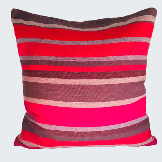 Striped red and brown pillow on a white background