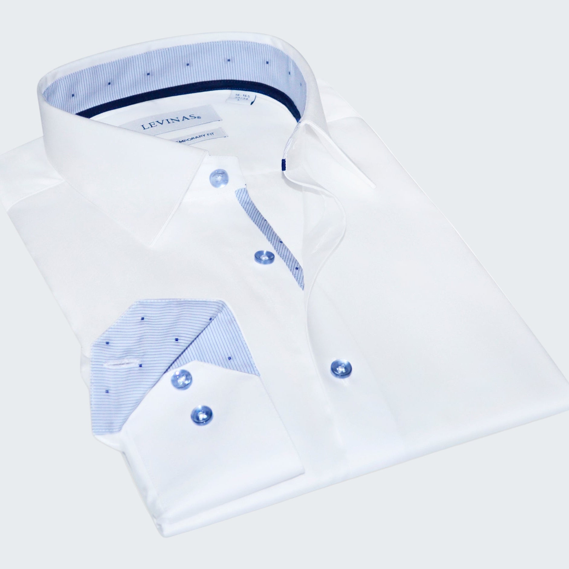 Folded white dress shirt with blue accents and Levi's branding on a white background