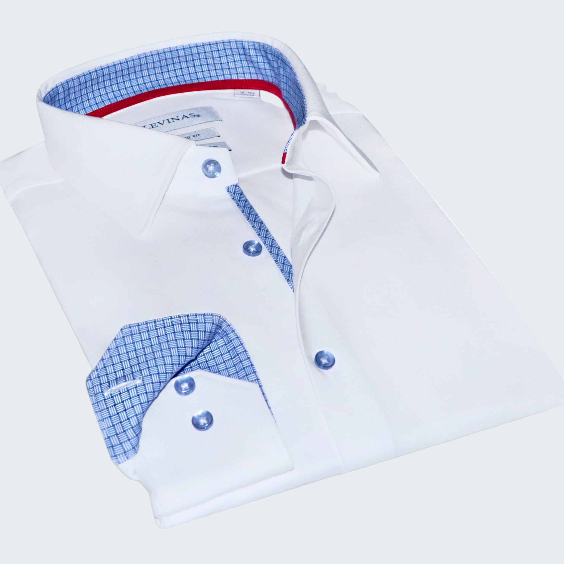 Folded white dress shirt with blue checkered interior on a white background