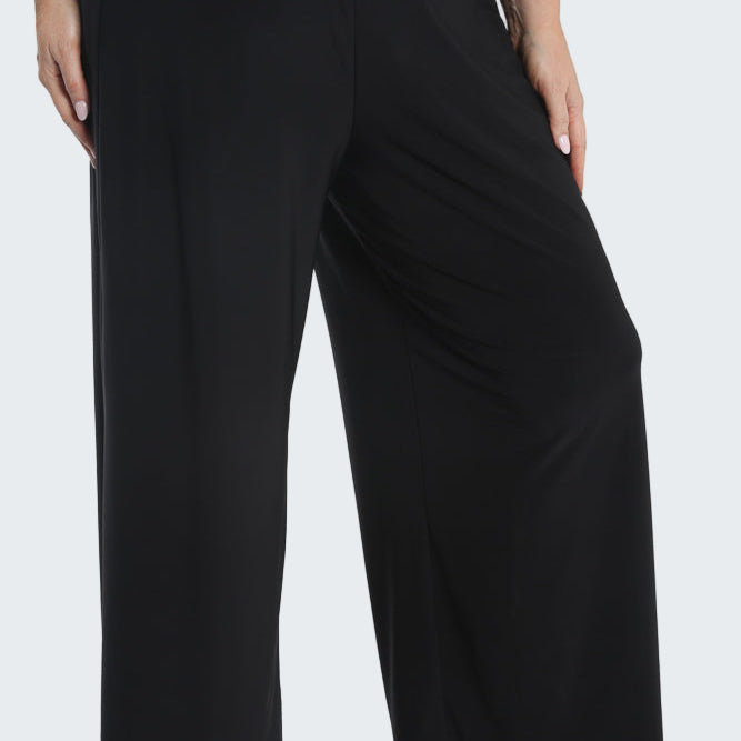 Black wide-leg pants worn by a person on a white background