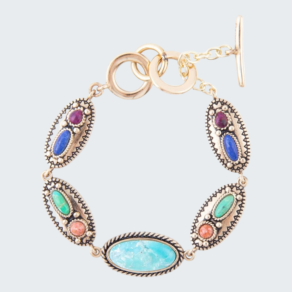 Multicolored gemstone bracelet with gold accents on a white background