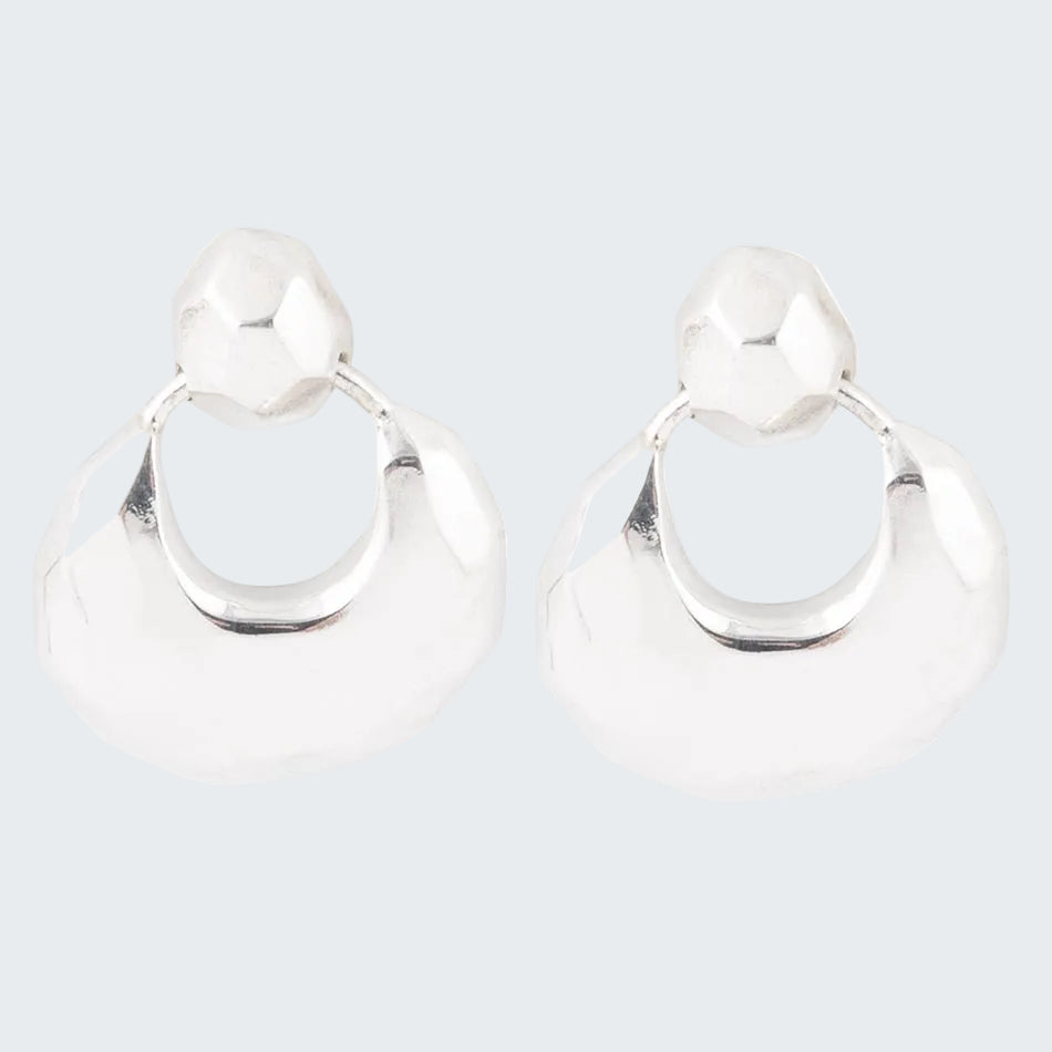 Pair of silver hoop earrings on a white background