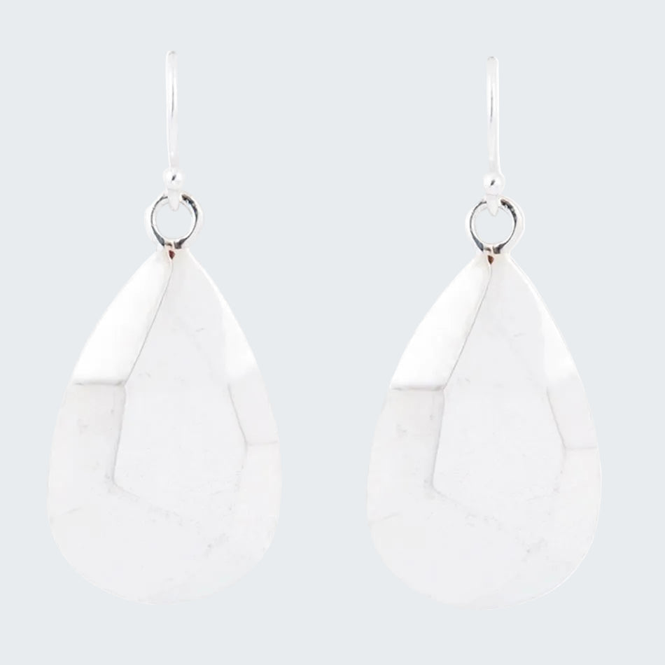 White teardrop earrings on a white background