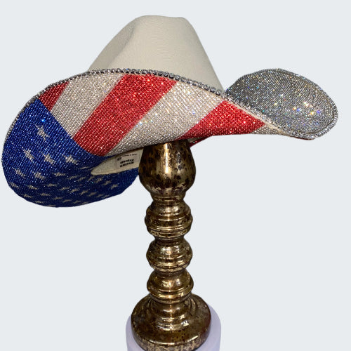 Decorative lamp with American flag design on a metallic stand against a glittery background