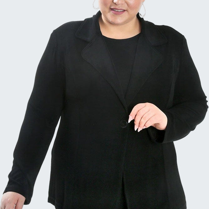 Woman wearing a black suit on a white background