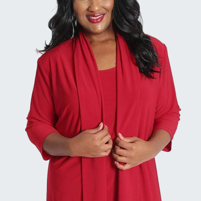 Woman wearing a red cardigan on a white background