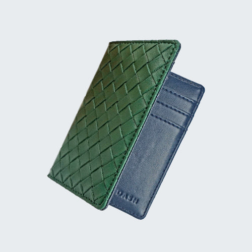 Green woven leather wallet and blue cardholder on a light gray background