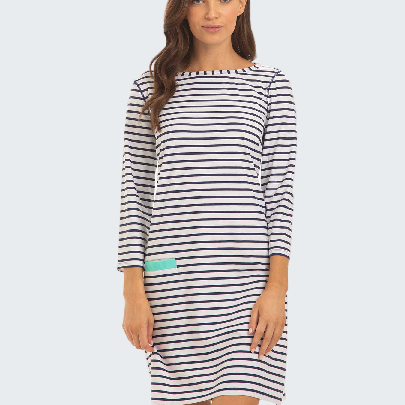 Woman wearing a black and white striped dress on a white background