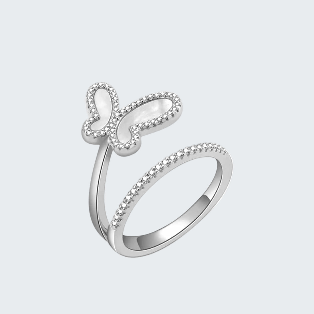 Silver ring with butterfly design on a white background