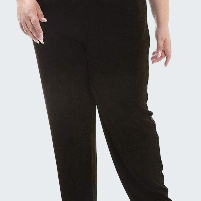 Black pants worn by a person on a white background
