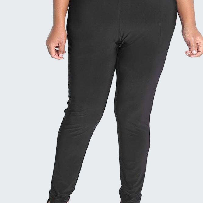 Person wearing black leggings on a white background