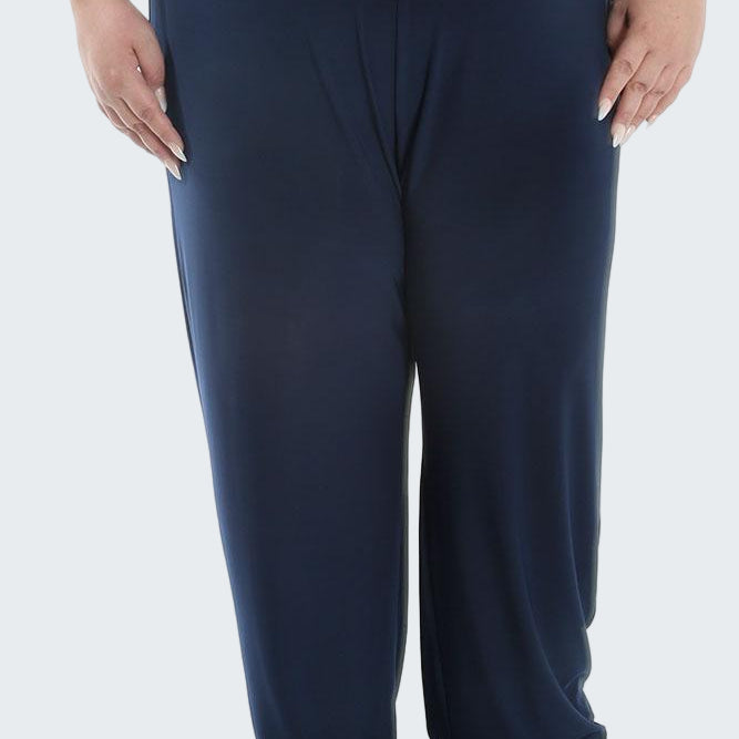 Navy blue pants worn by a person on a white background