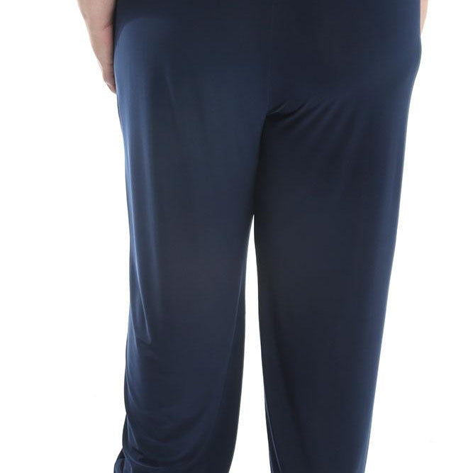 Navy blue pants worn by a person on a white background