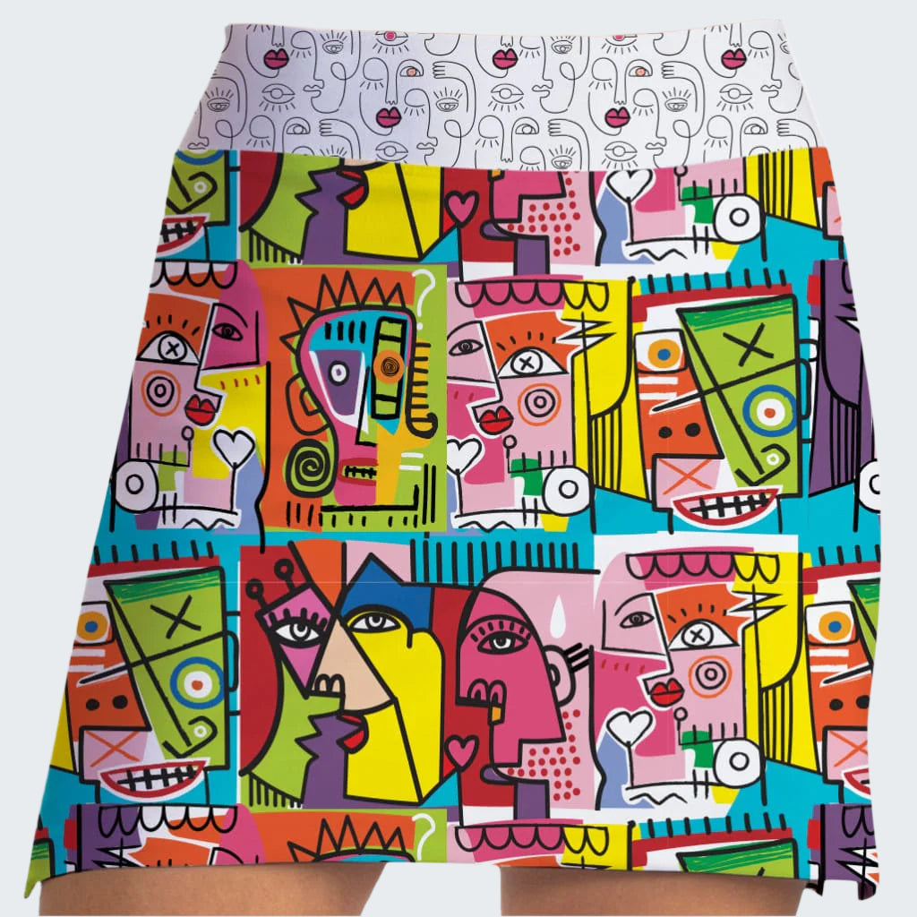 Colorful abstract patterned skirt with geometric shapes and faces.