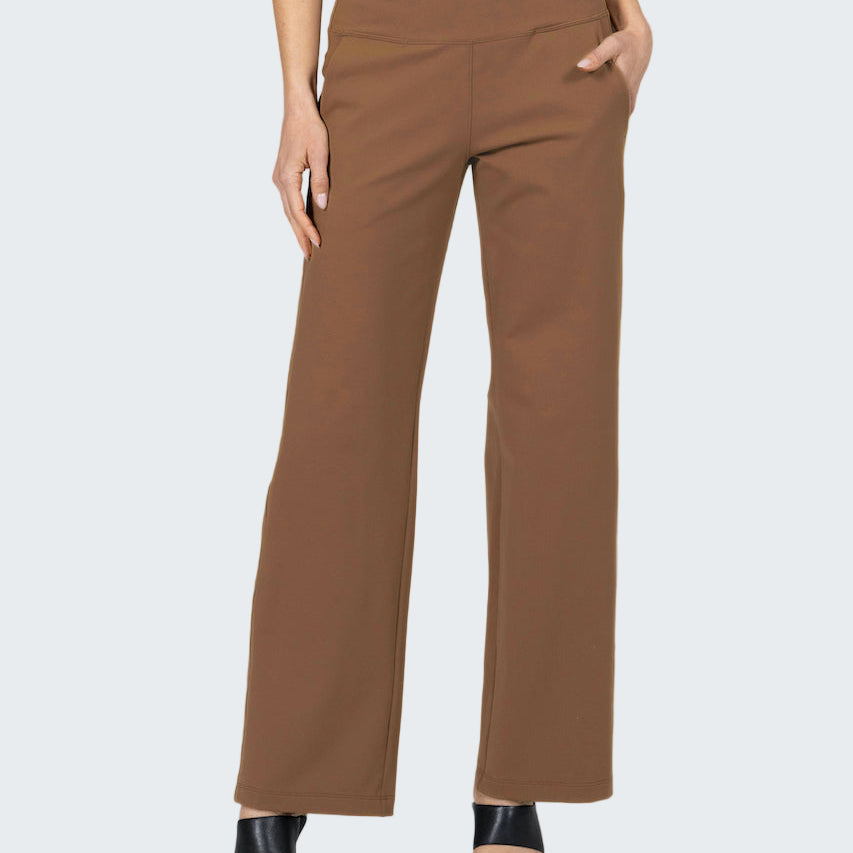 Brown pants worn by a person on a gray background