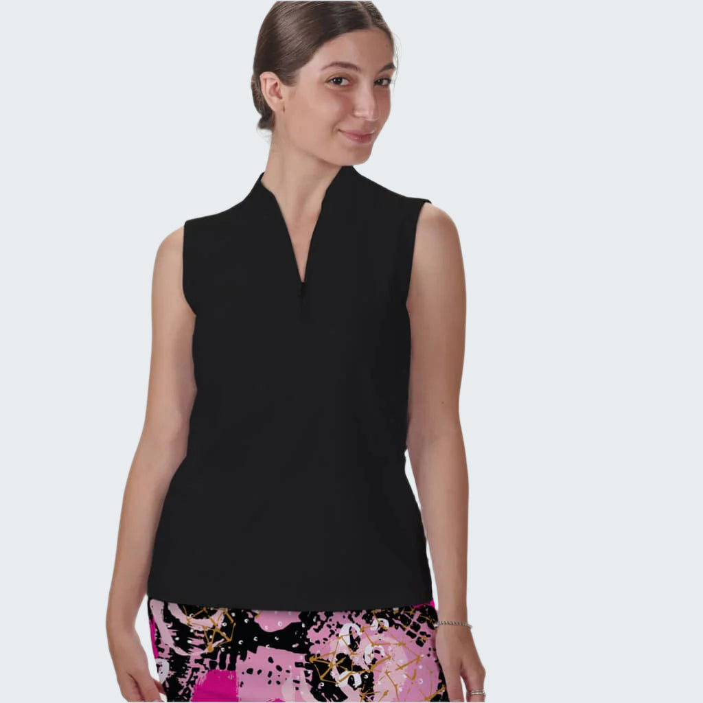 Woman wearing a black sleeveless top with patterned pants on a white background