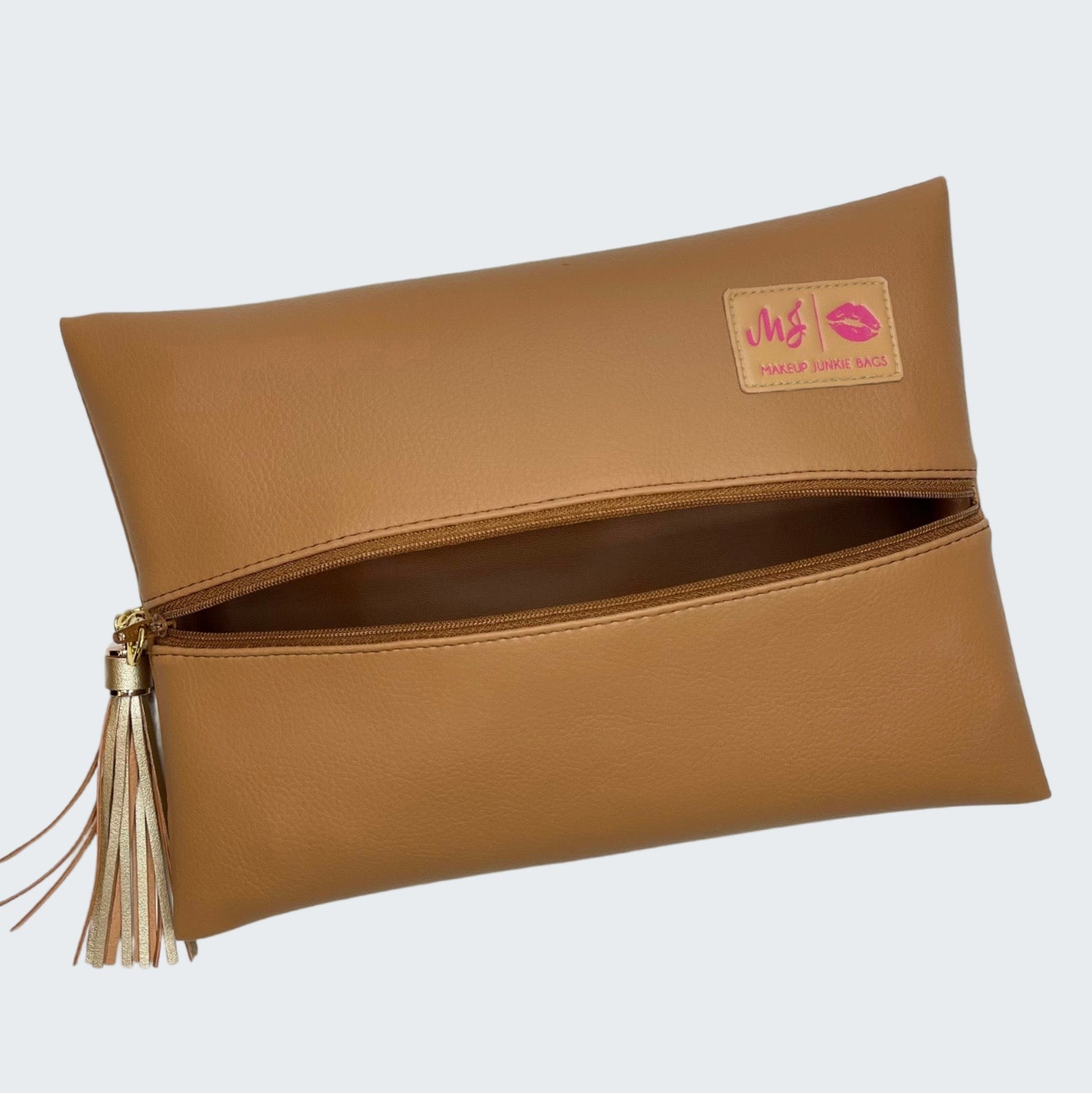 Brown clutch bag with a visible brand label on a white background