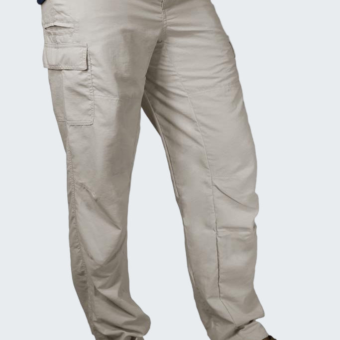 Beige cargo pants worn by a person on a white background