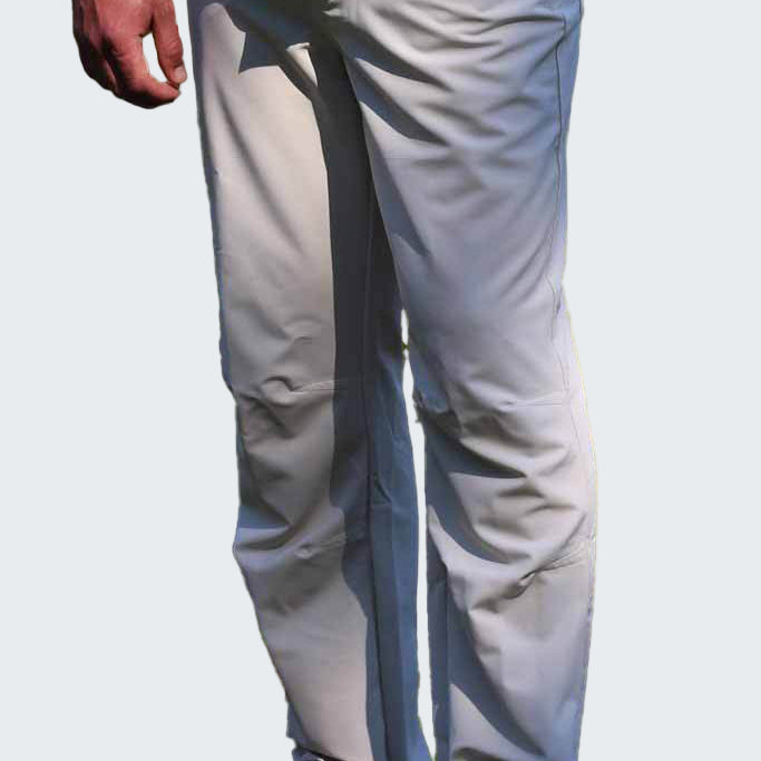Person wearing light gray pants with a dark stripe on a white background