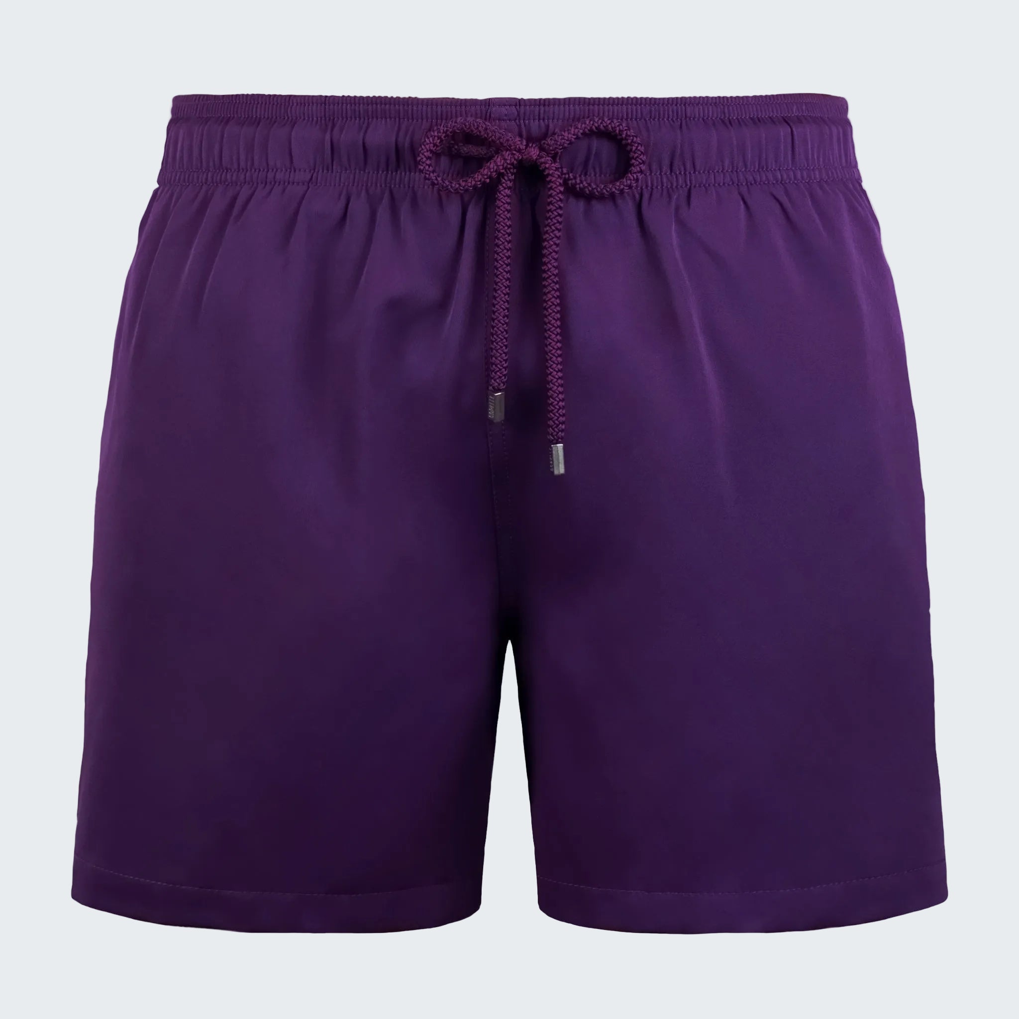 Purple shorts with a drawstring on a white background