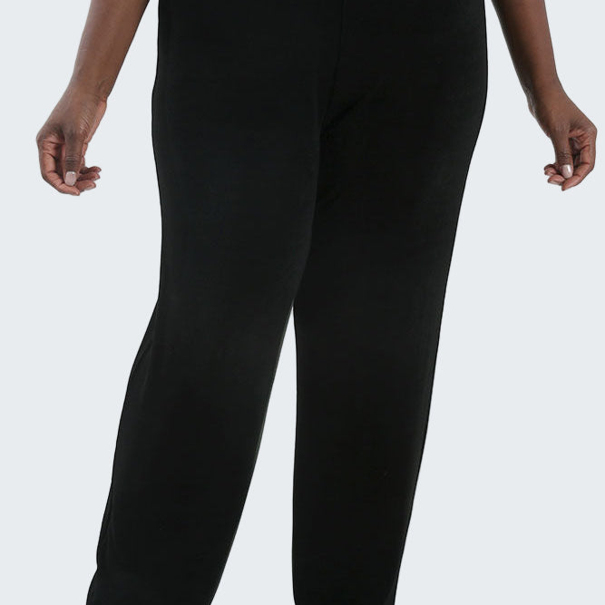 Person wearing black pants on a white background