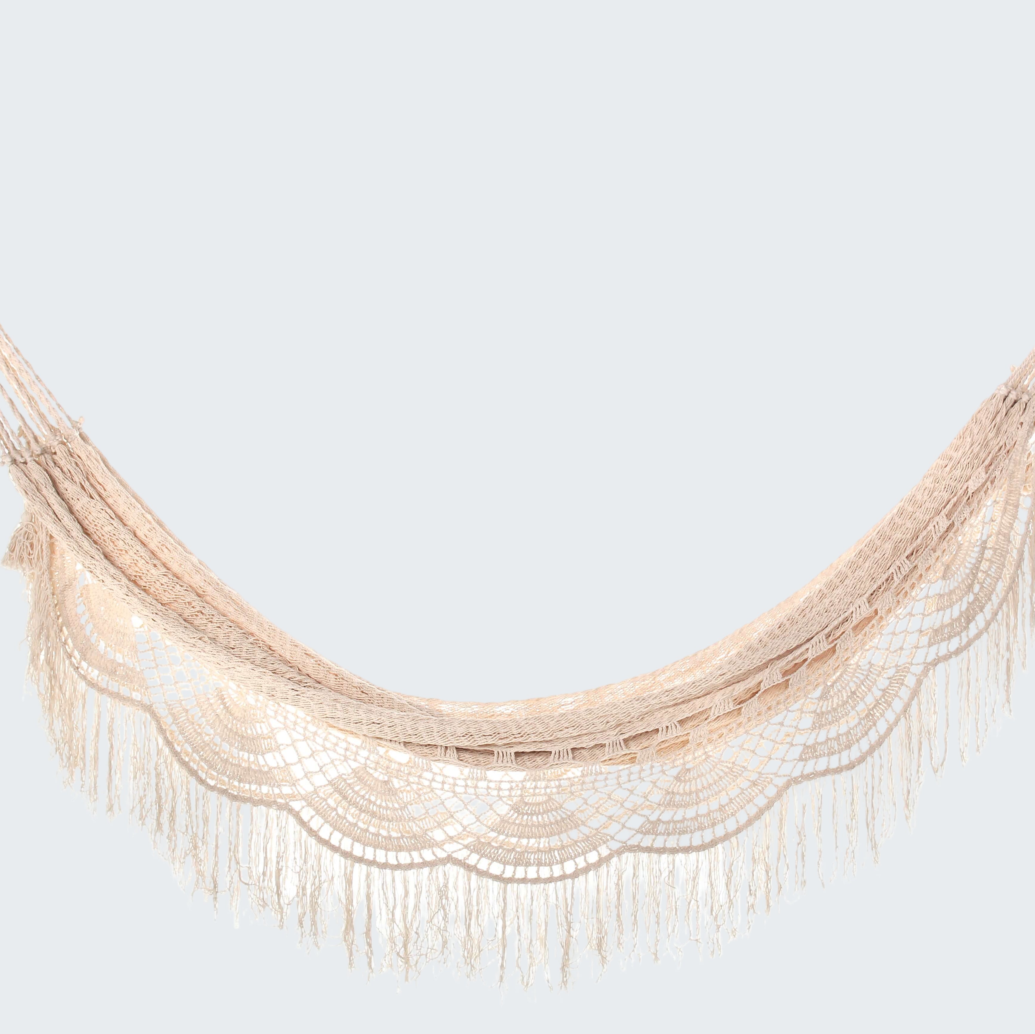 Beige hammock swing with fringe on a white background