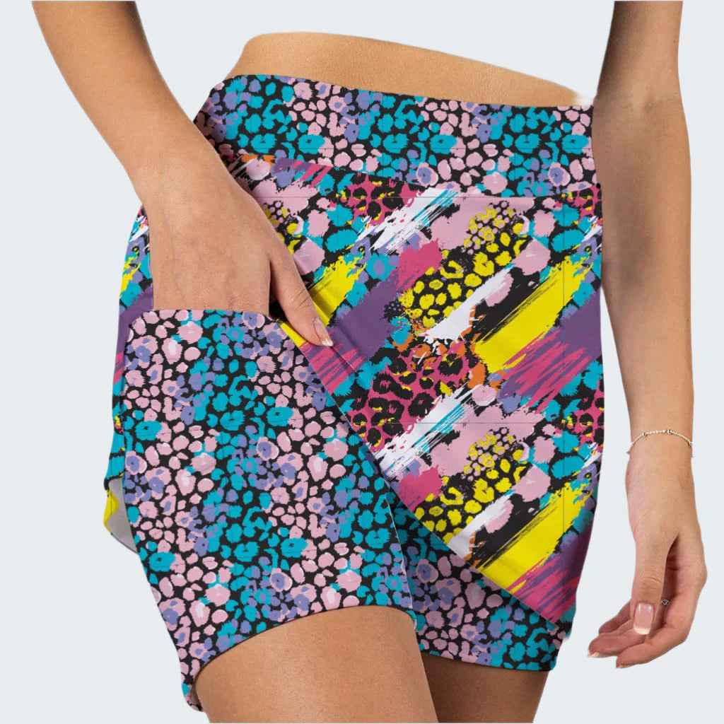 Colorful abstract patterned shorts on a plain background
